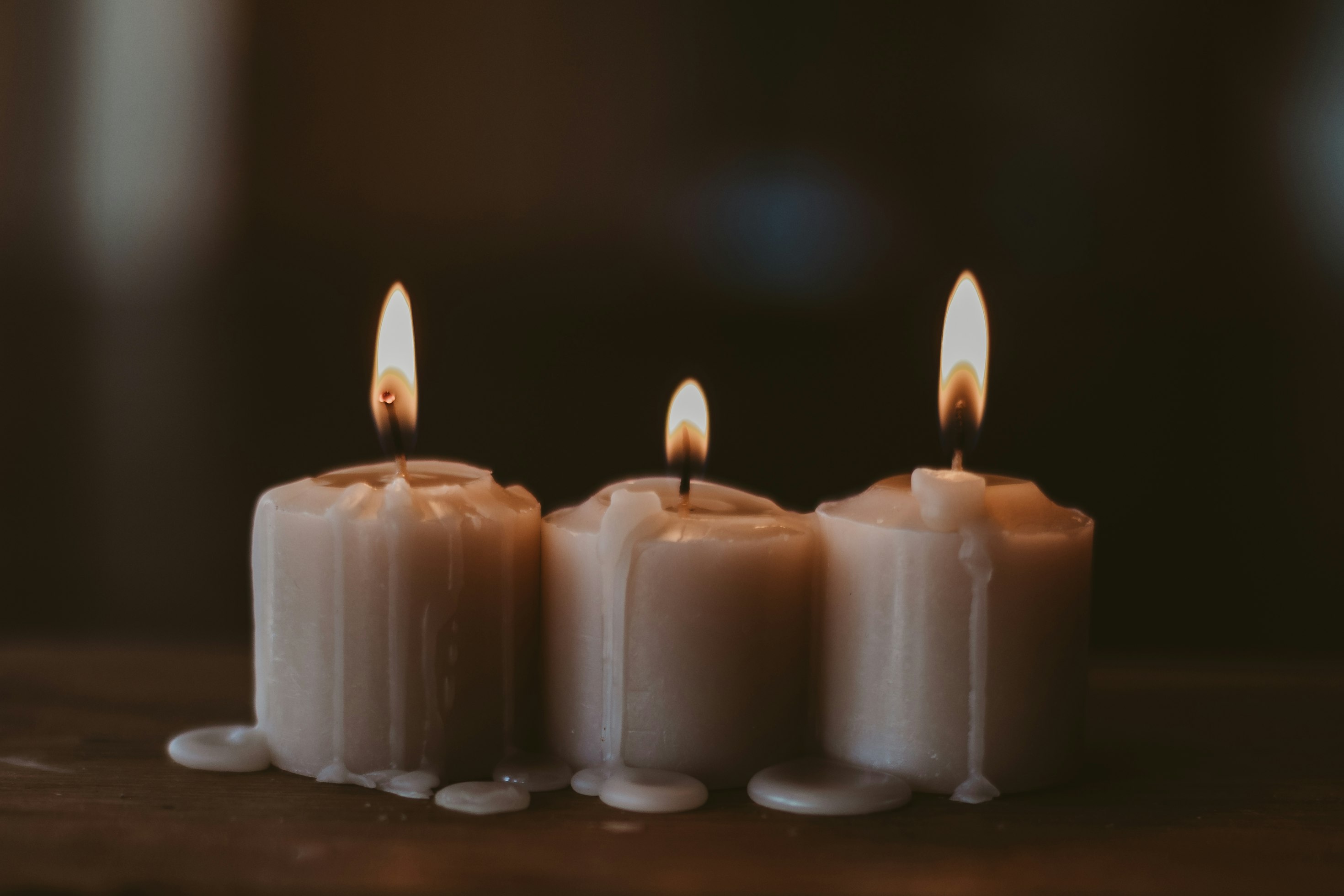 Sacred ritual ceremony altar with candles, crystals, and warm golden light